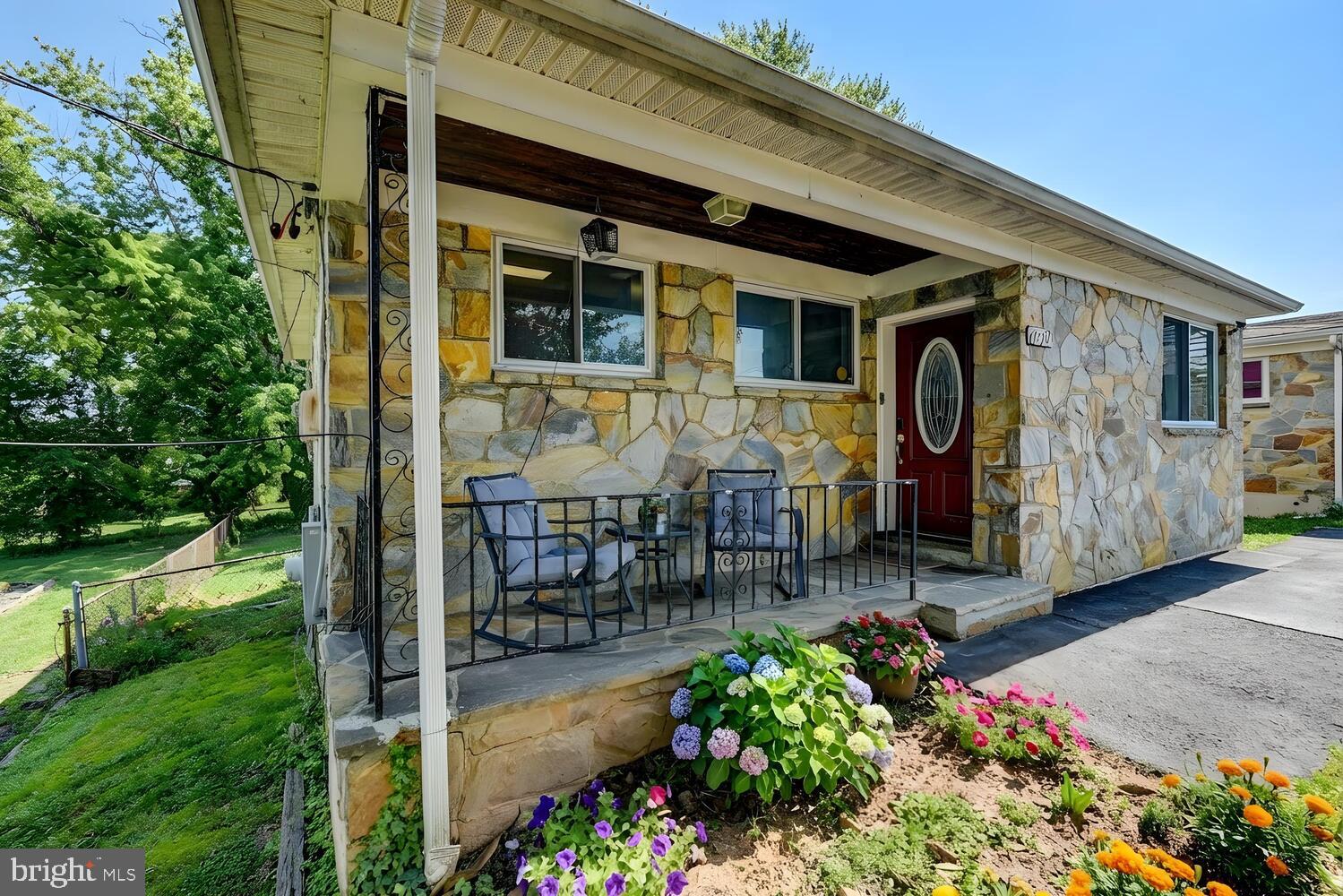 6420 Kenwood Avenue Rosedale, MD 21237 - Photo 3 of 22 a front view of a house with garden