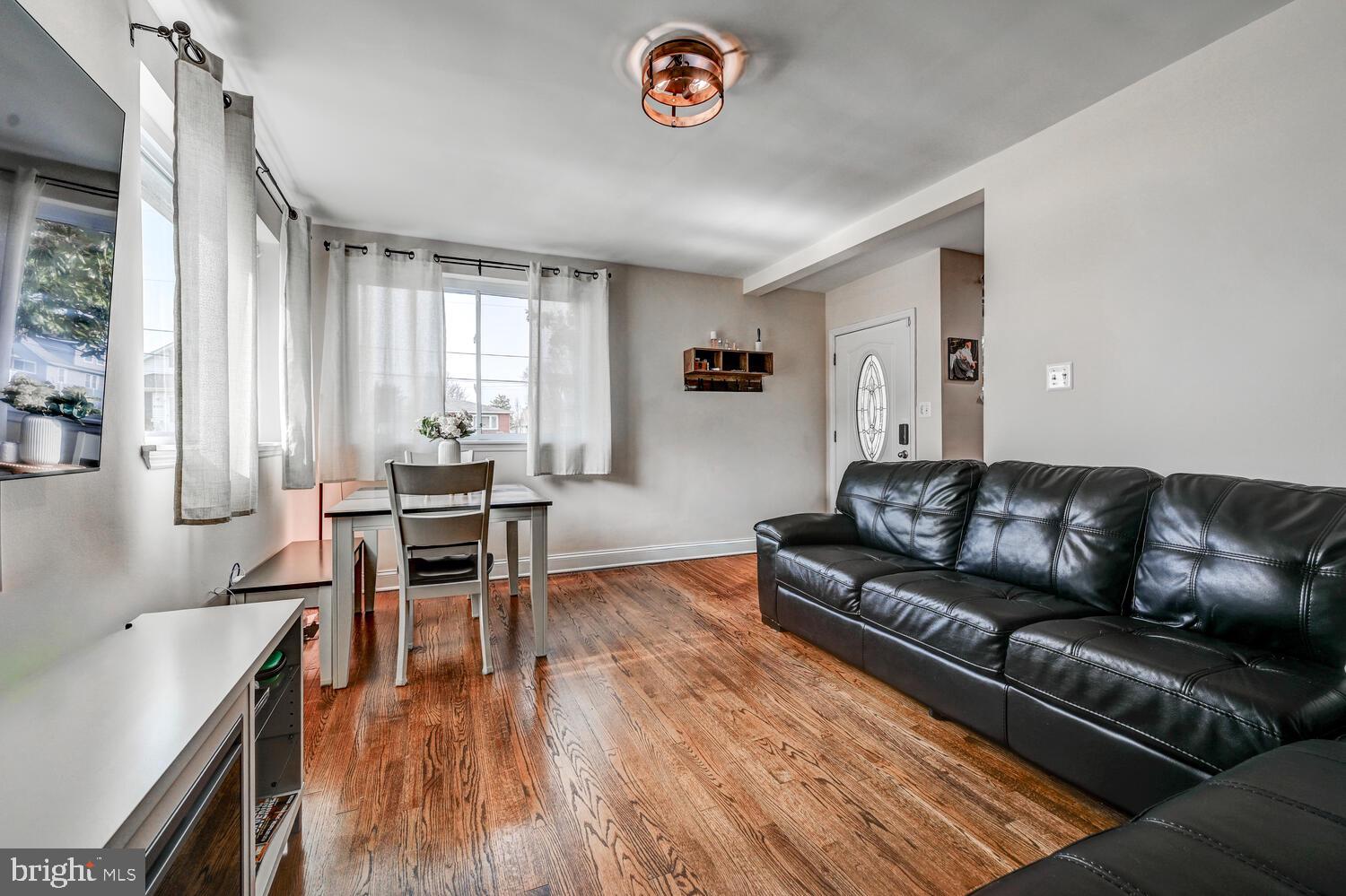 6420 Kenwood Avenue Rosedale, MD 21237 - Photo 4 of 22 a living room with furniture and a table