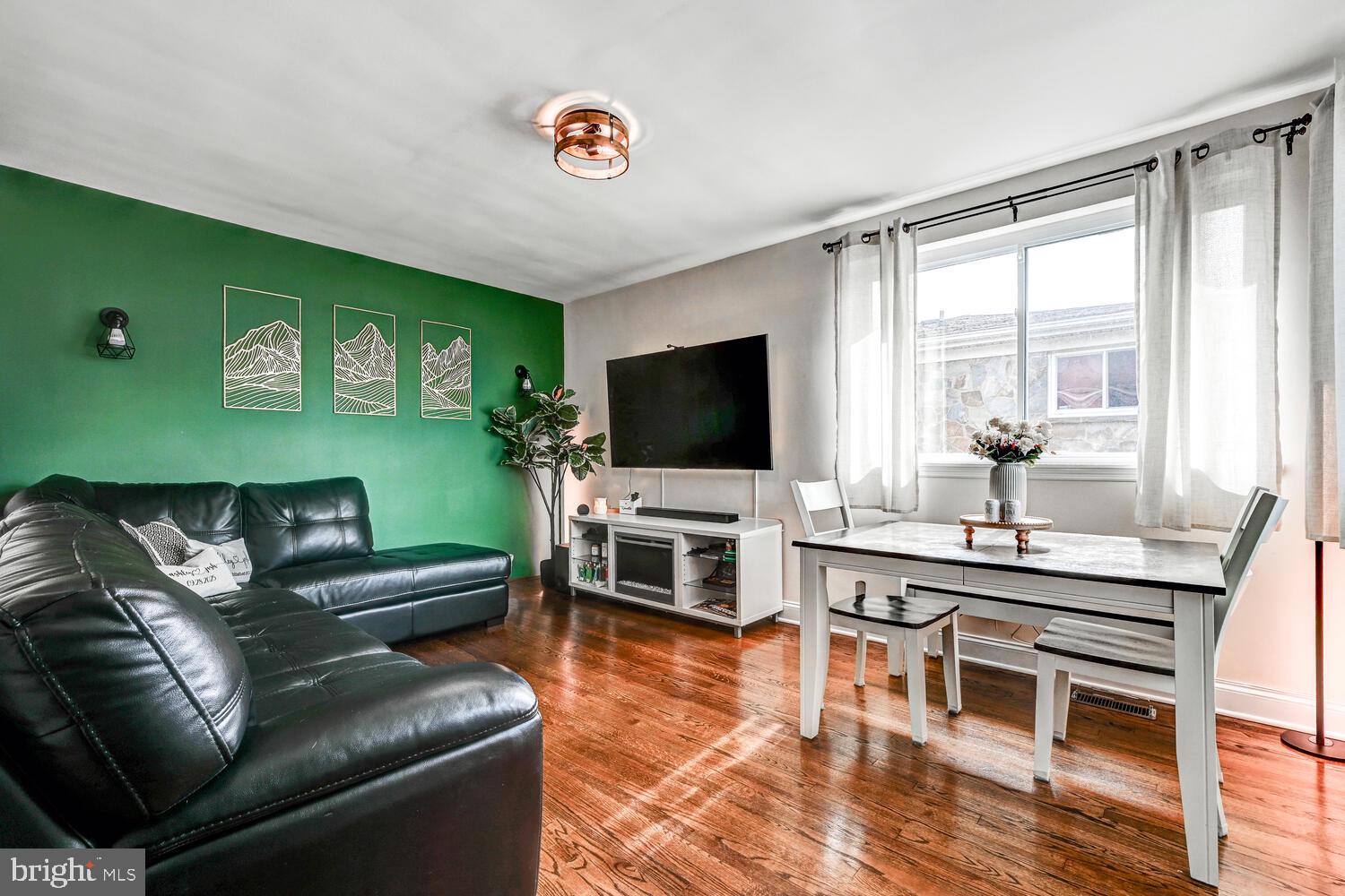 6420 Kenwood Avenue Rosedale, MD 21237 - Photo 5 of 22 a living room with furniture and a flat screen tv