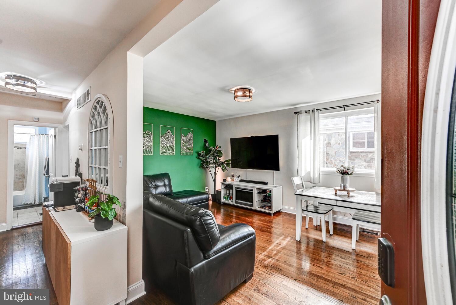 6420 Kenwood Avenue Rosedale, MD 21237 - Photo 6 of 22 a living room with furniture and a flat screen tv