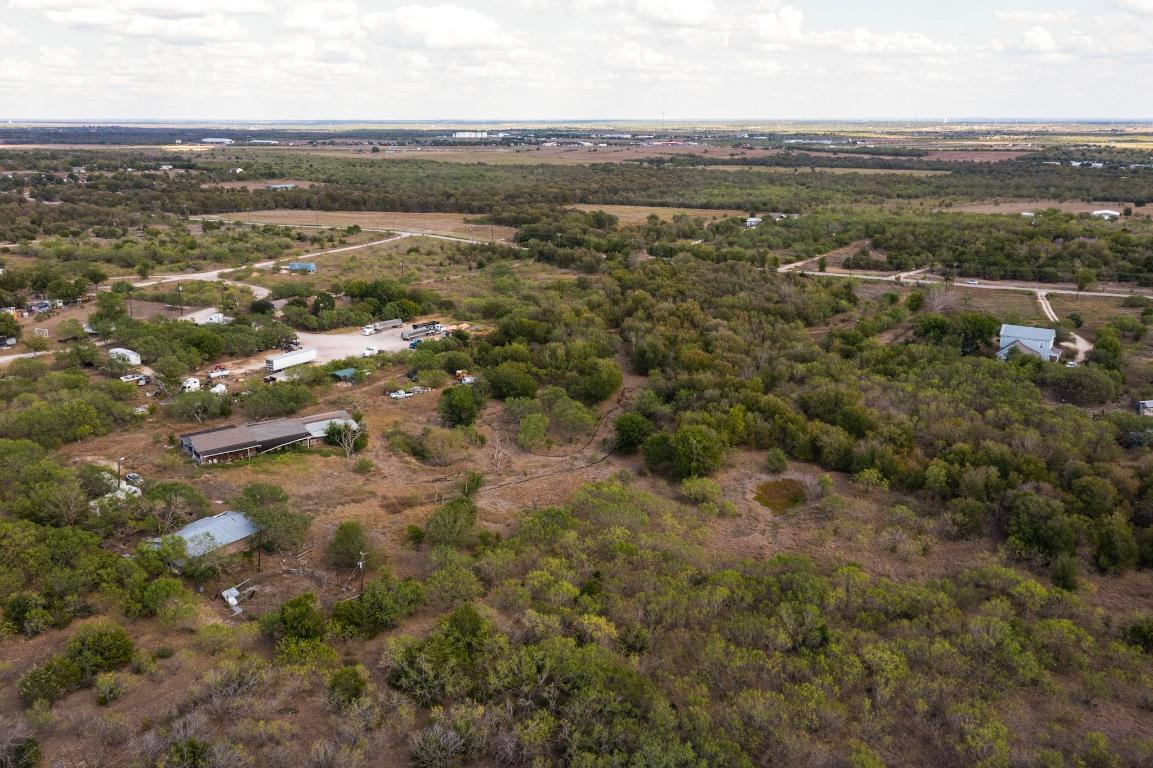13414 Elm Grove Road Buda, TX 78610 - Photo 18 of 25 an aerial view of residential houses with outdoor space and trees