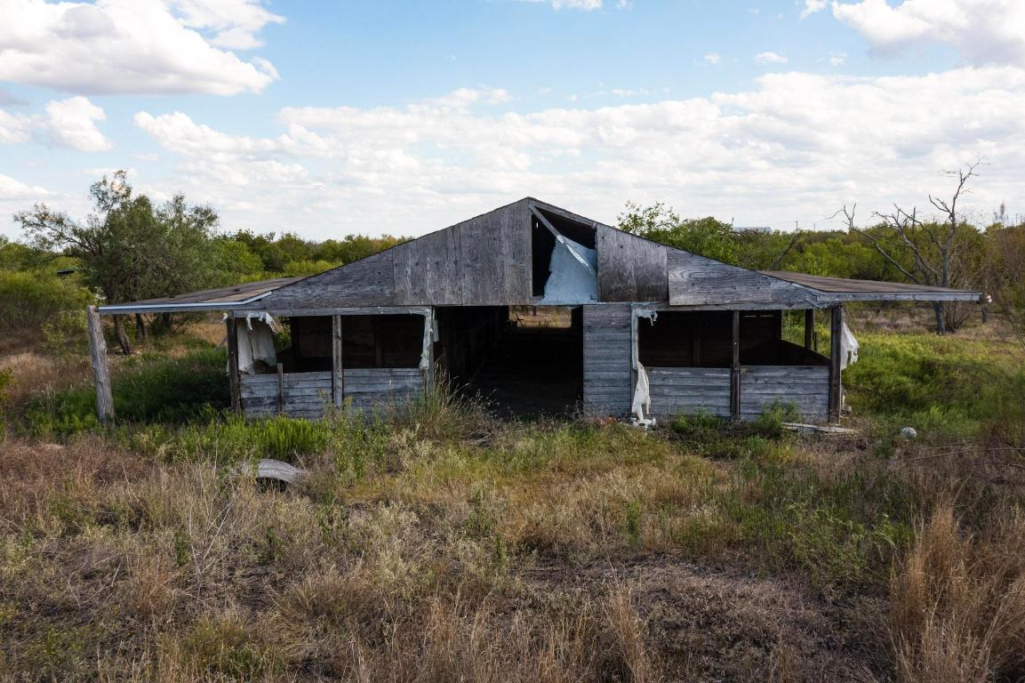 13414 Elm Grove Road Buda, TX 78610 - Photo 9 of 25 a view of a house with a yard