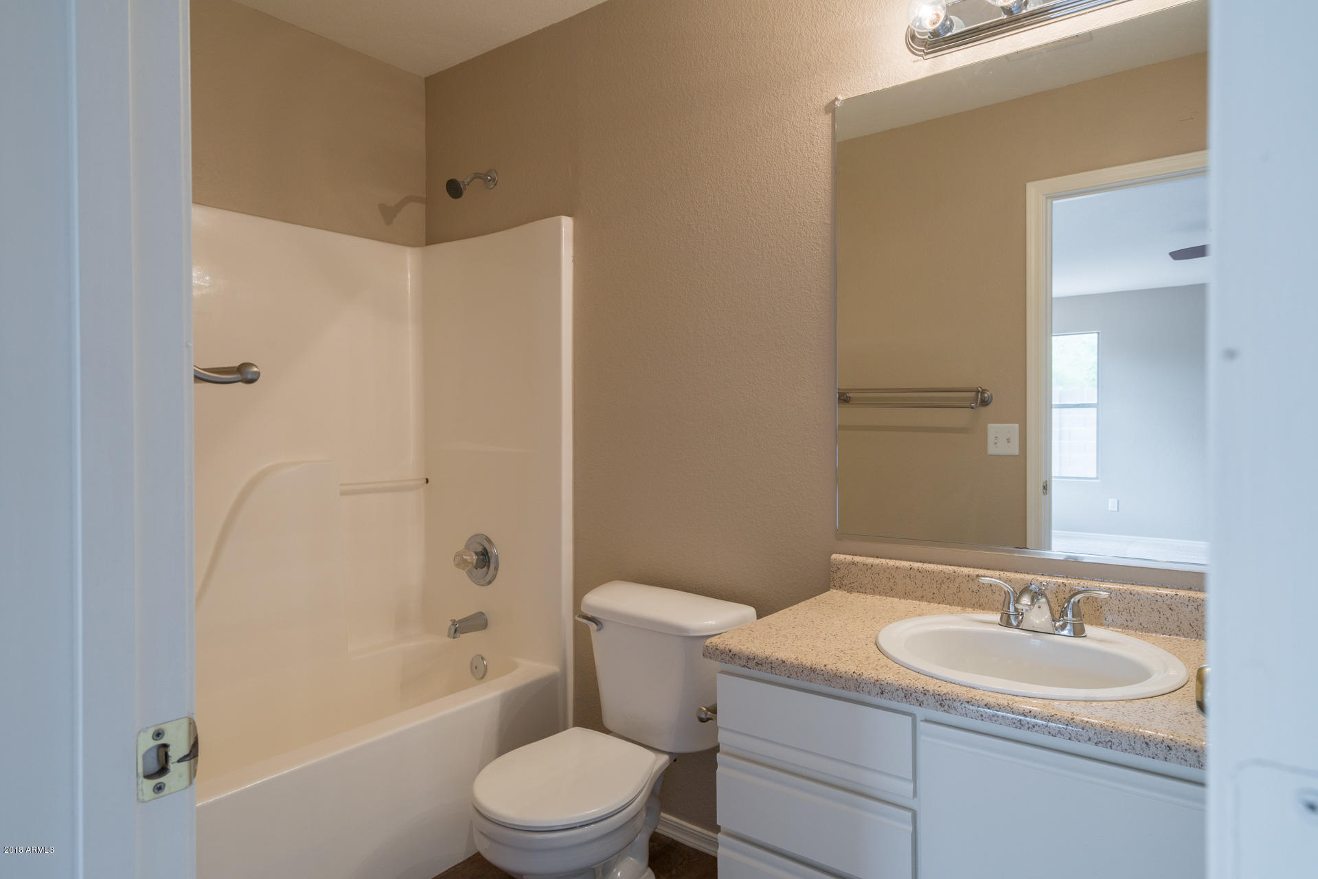 107 South Noble Mesa, AZ 85208 - Photo 13 of 23 a bathroom with a sink a toilet and shower