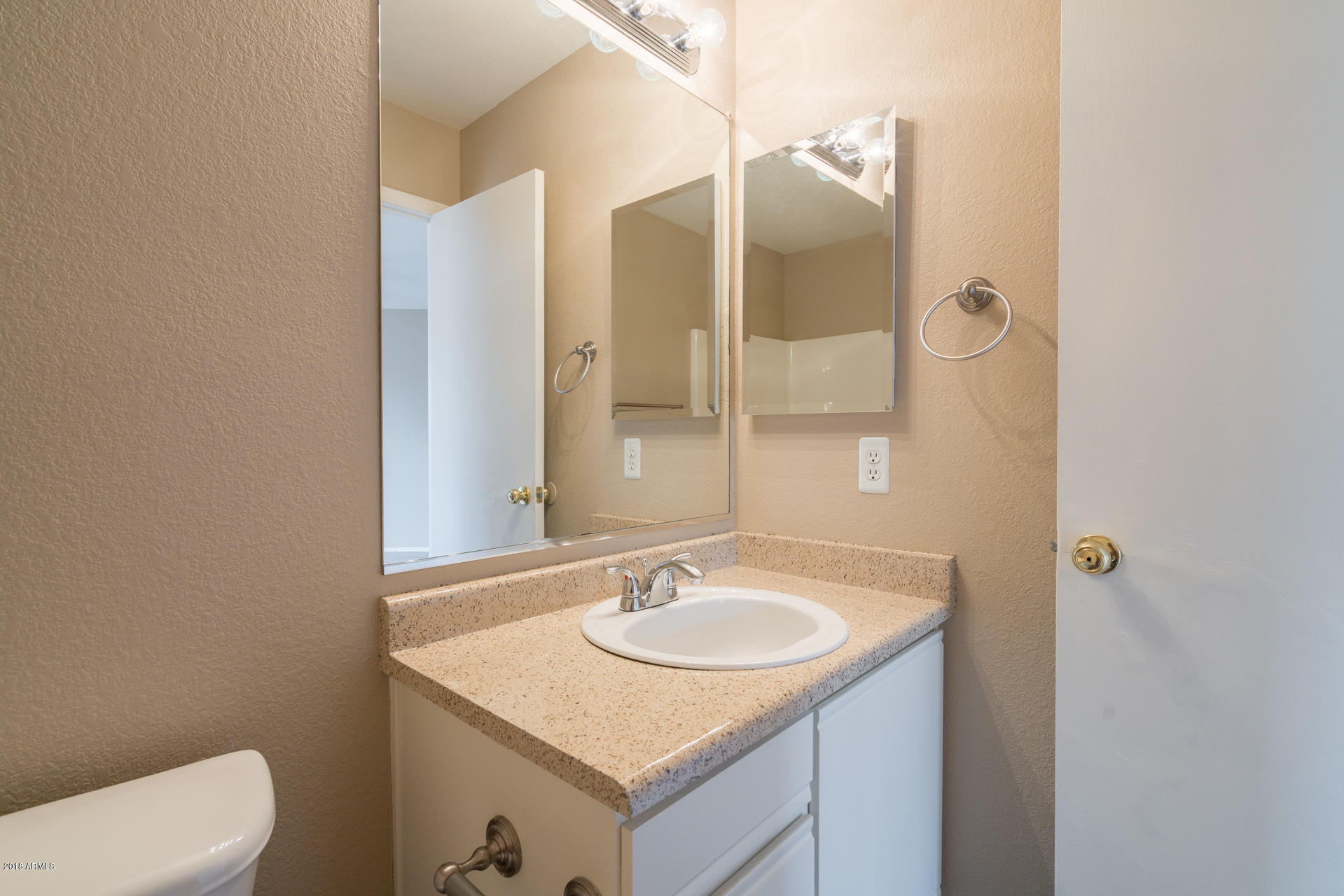 107 South Noble Mesa, AZ 85208 - Photo 15 of 23 a bathroom with a sink toilet and shower