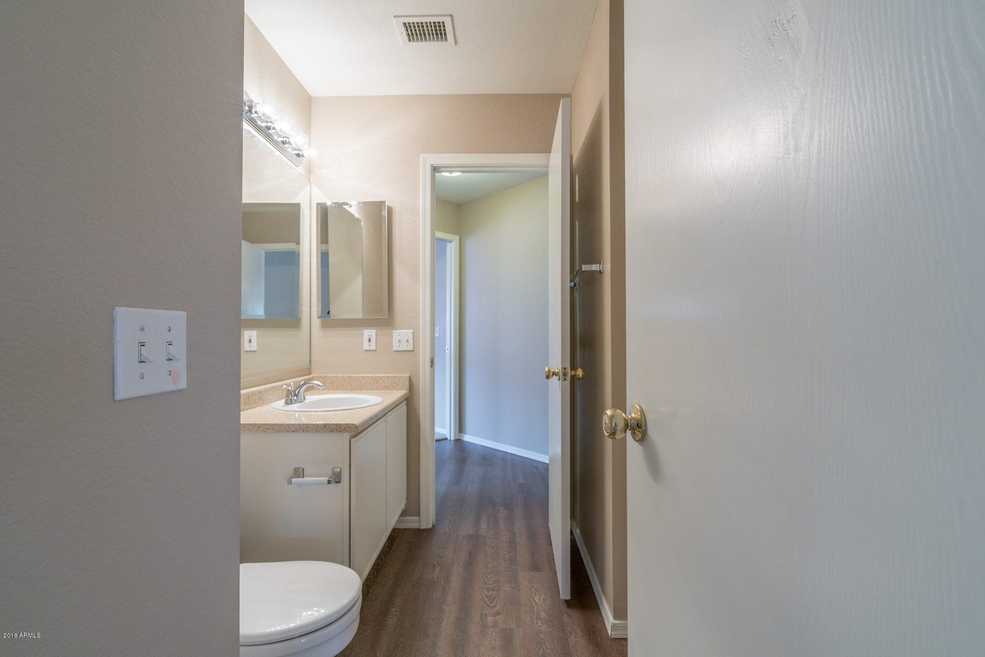 107 South Noble Mesa, AZ 85208 - Photo 17 of 23 a bathroom with a sink a toilet a tub and shower