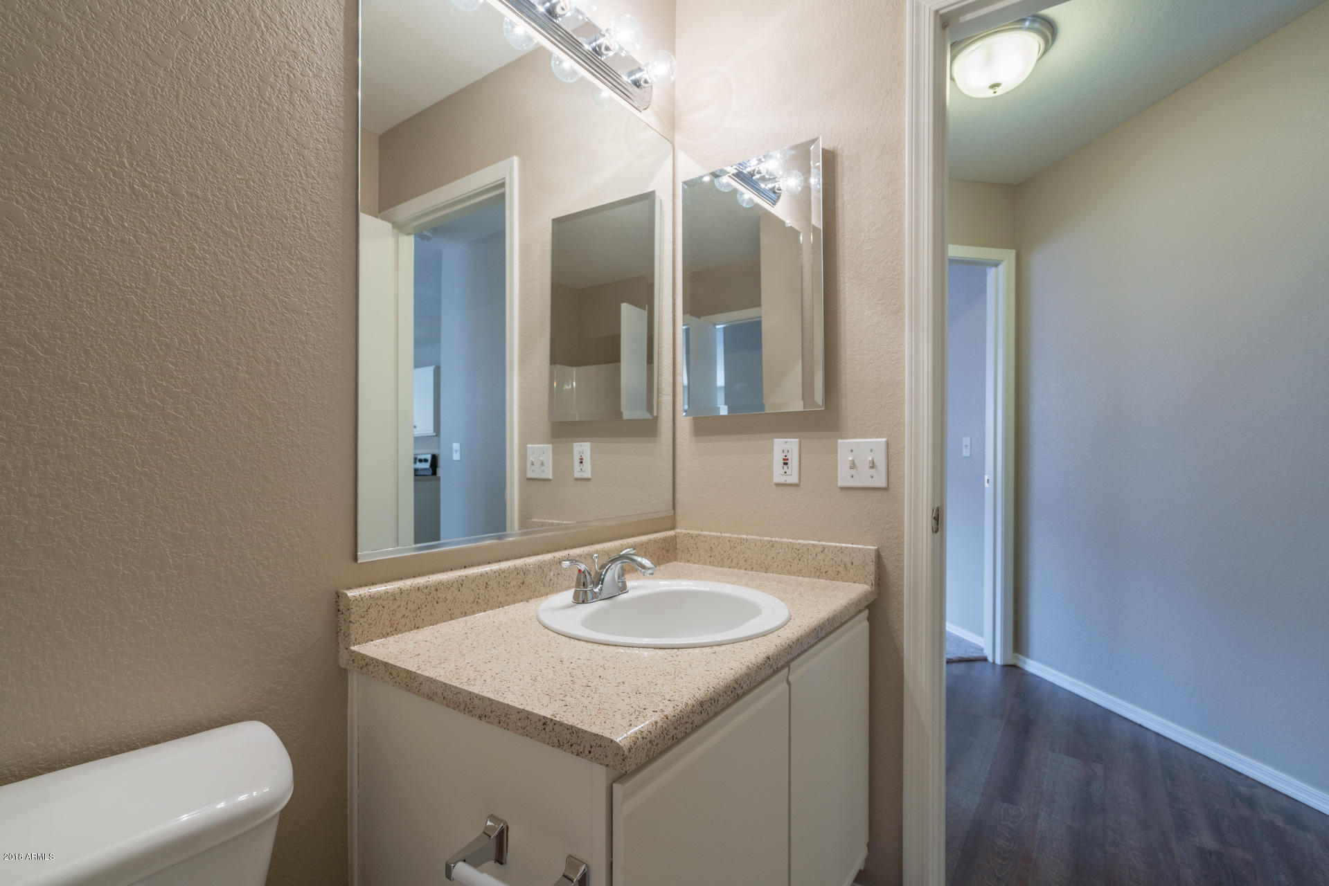 107 South Noble Mesa, AZ 85208 - Photo 18 of 23 a bathroom with a sink toilet and mirror