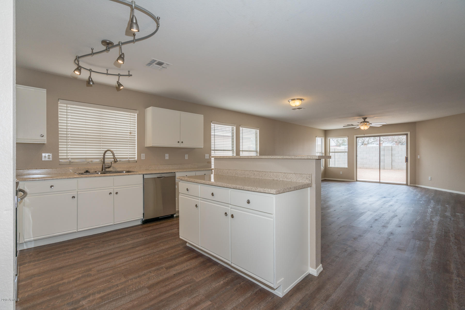 107 South Noble Mesa, AZ 85208 - Photo 4 of 23 a large kitchen with a lot of counter space and wooden floor