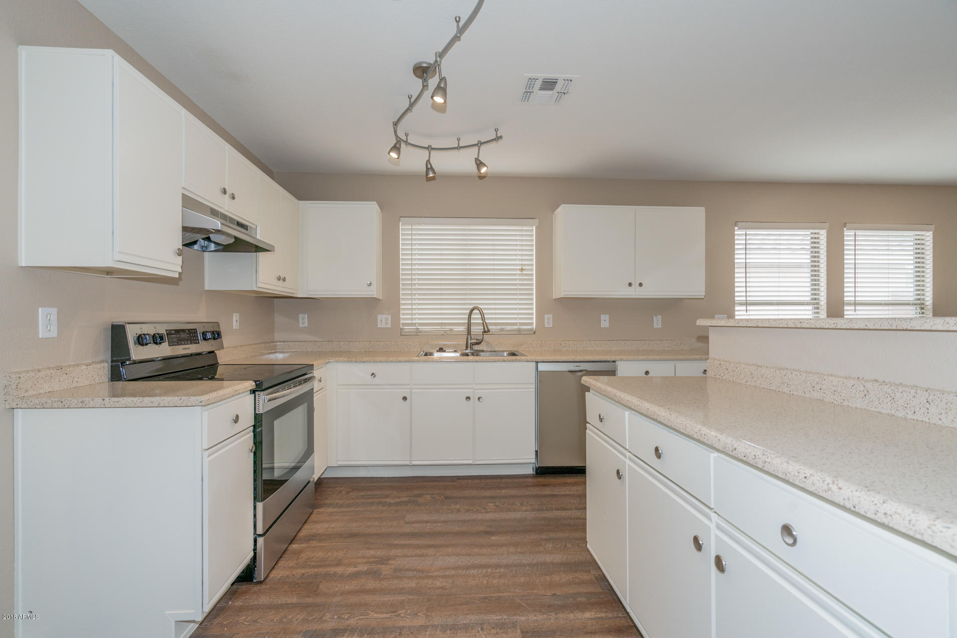 107 South Noble Mesa, AZ 85208 - Photo 5 of 23 a kitchen with a sink window and cabinets