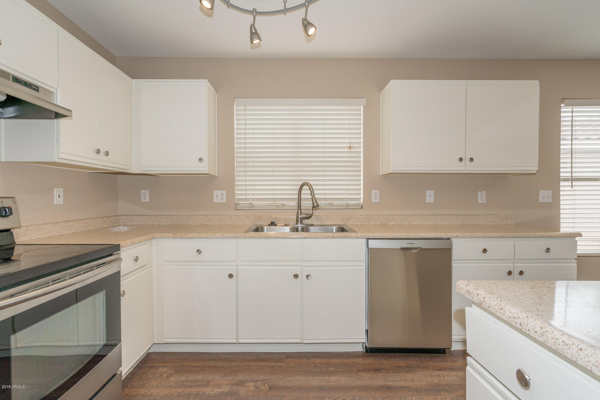 107 South Noble Mesa, AZ 85208 - Photo 6 of 23 a kitchen with cabinets appliances a sink and a window