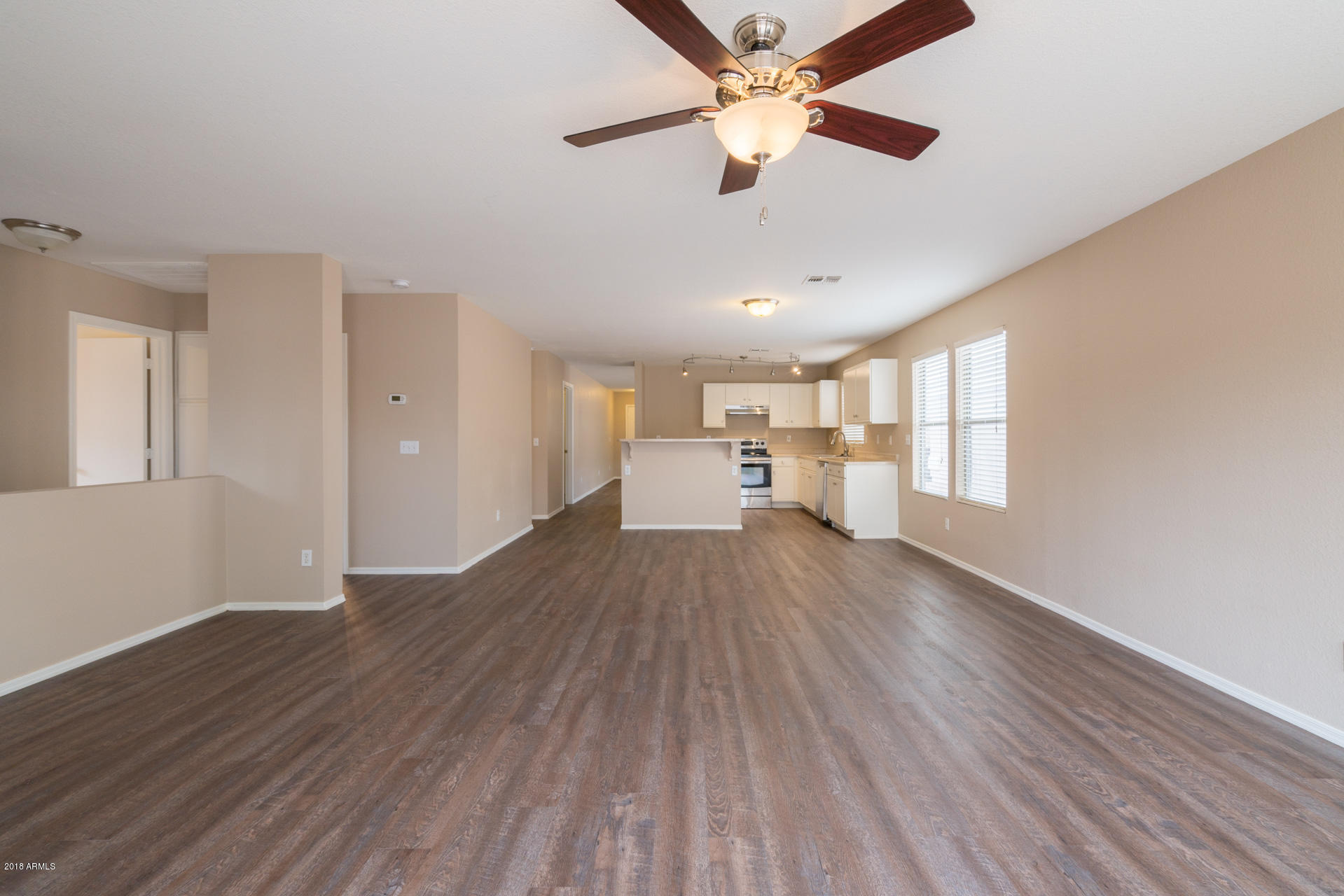 107 South Noble Mesa, AZ 85208 - Photo 10 of 23 wooden floor in an empty room with a window