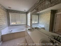 3540 Cornwallis Road Garner, NC 27529 - Photo 15 of 18 a bathroom with a tub sink and mirror