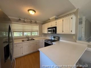 3540 Cornwallis Road Garner, NC 27529 - Photo 8 of 18 a kitchen with stainless steel appliances a sink a stove a refrigerator cabinets and a counter top space