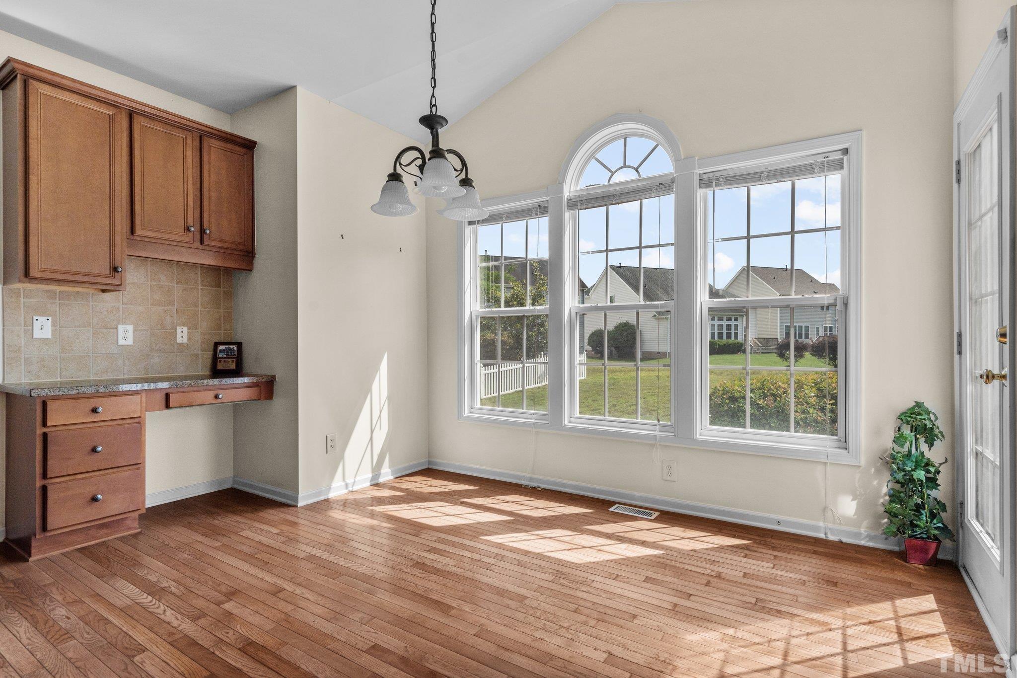 6010 Clarks Fork Drive Raleigh, NC 27616 - Photo 16 of 40 a view of a kitchen with an empty space and a window