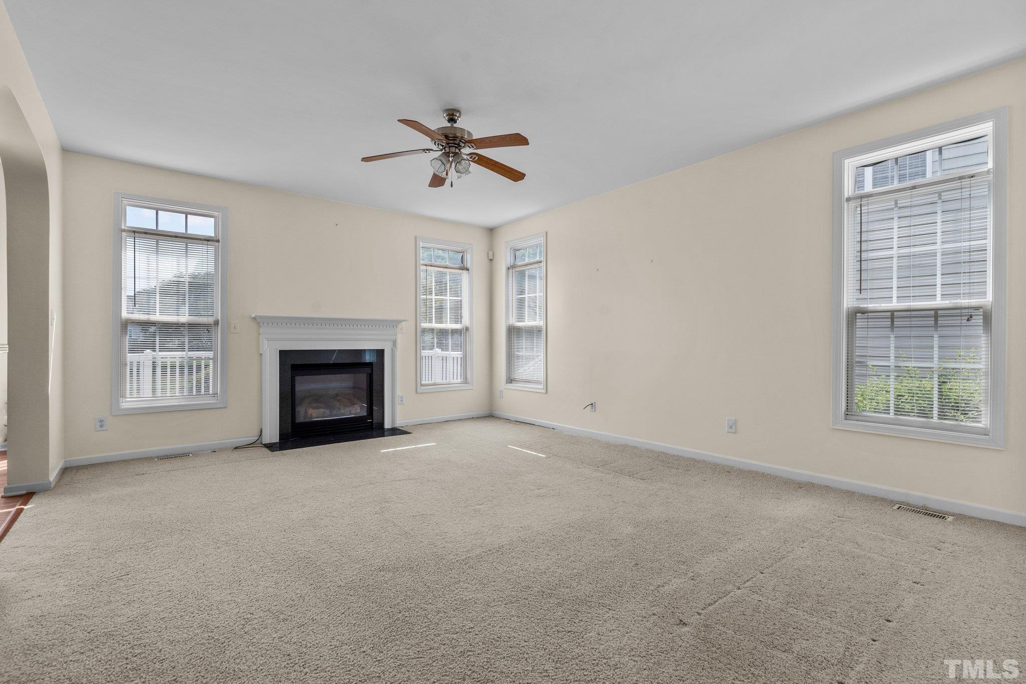 6010 Clarks Fork Drive Raleigh, NC 27616 - Photo 18 of 40 a view of empty room with a fireplace