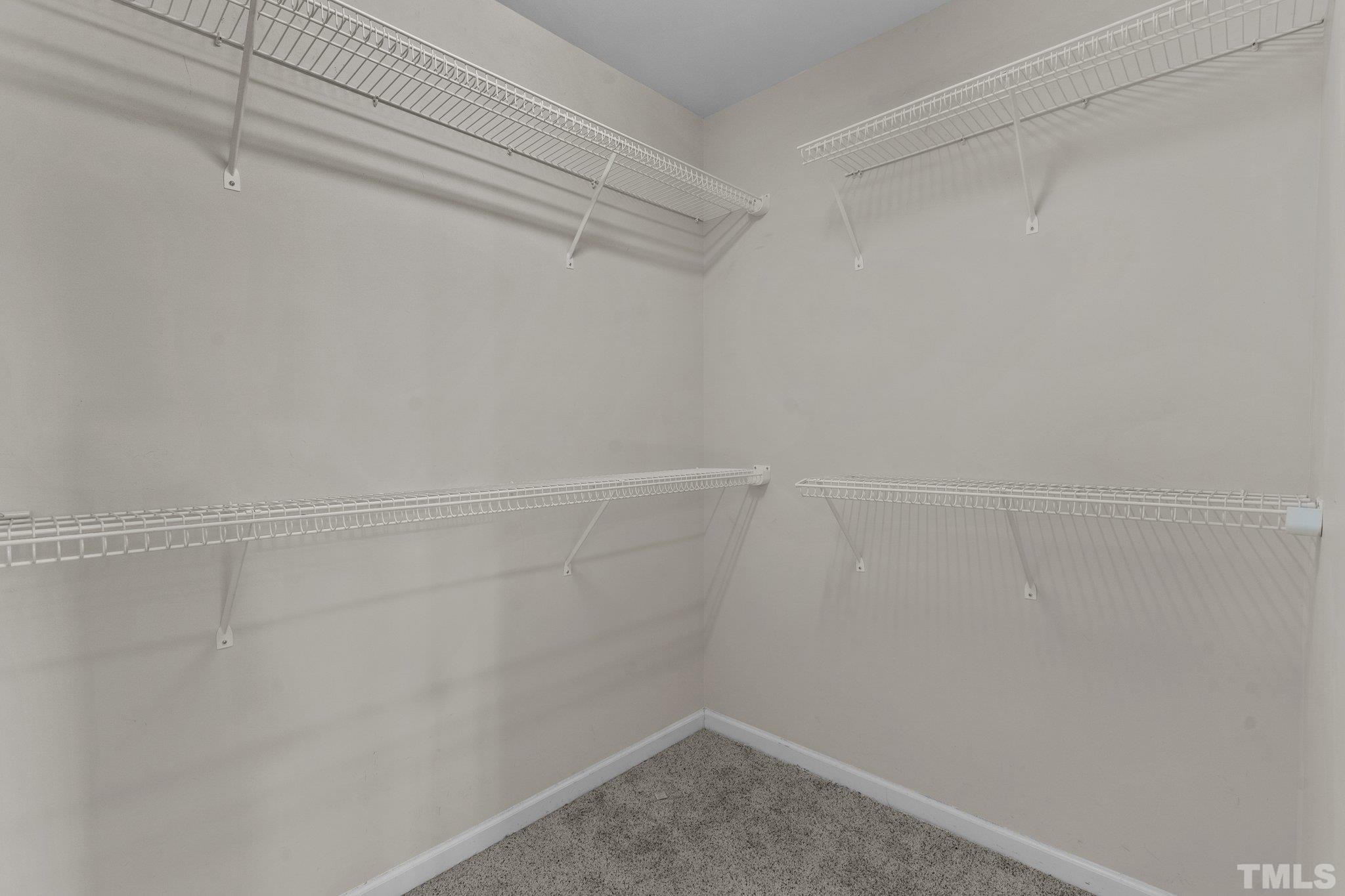 6010 Clarks Fork Drive Raleigh, NC 27616 - Photo 27 of 40 a view of a room with racks on the wall