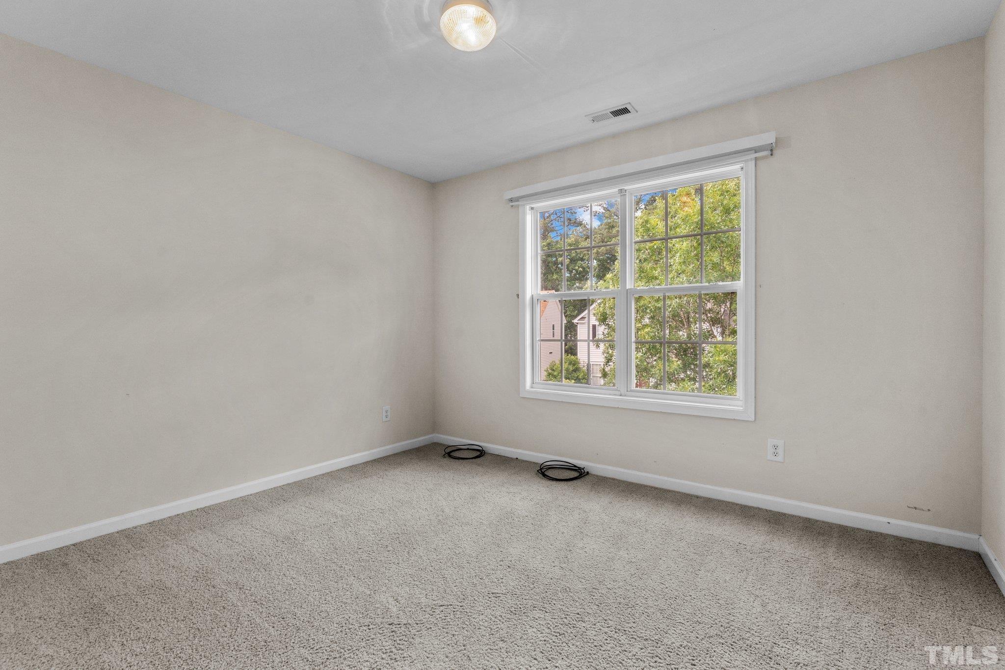 6010 Clarks Fork Drive Raleigh, NC 27616 - Photo 28 of 40 an empty room with windows