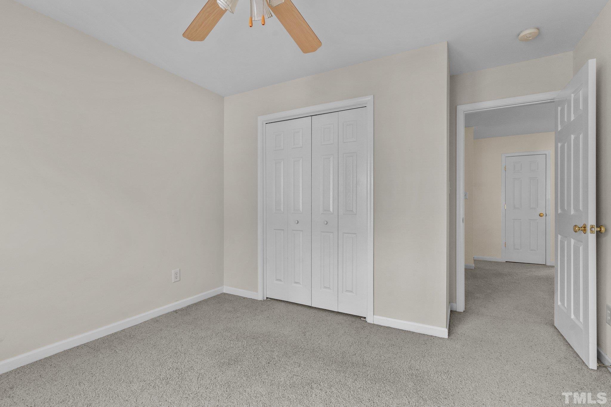 6010 Clarks Fork Drive Raleigh, NC 27616 - Photo 30 of 40 an empty room with a ceiling fan