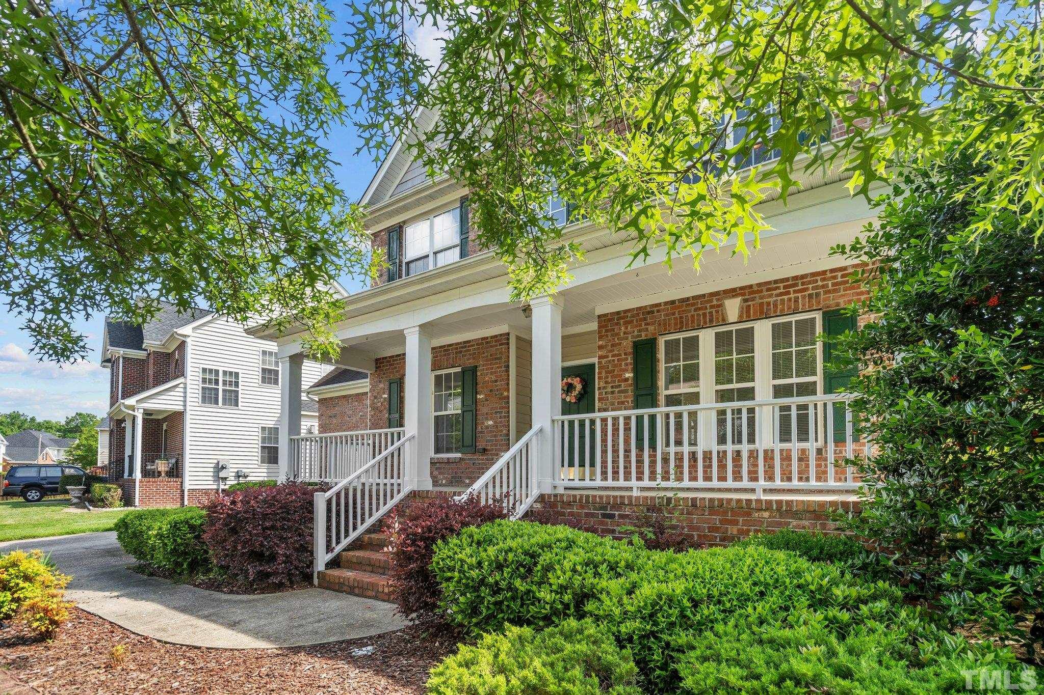 6010 Clarks Fork Drive Raleigh, NC 27616 - Photo 3 of 40 a front view of a house with garden