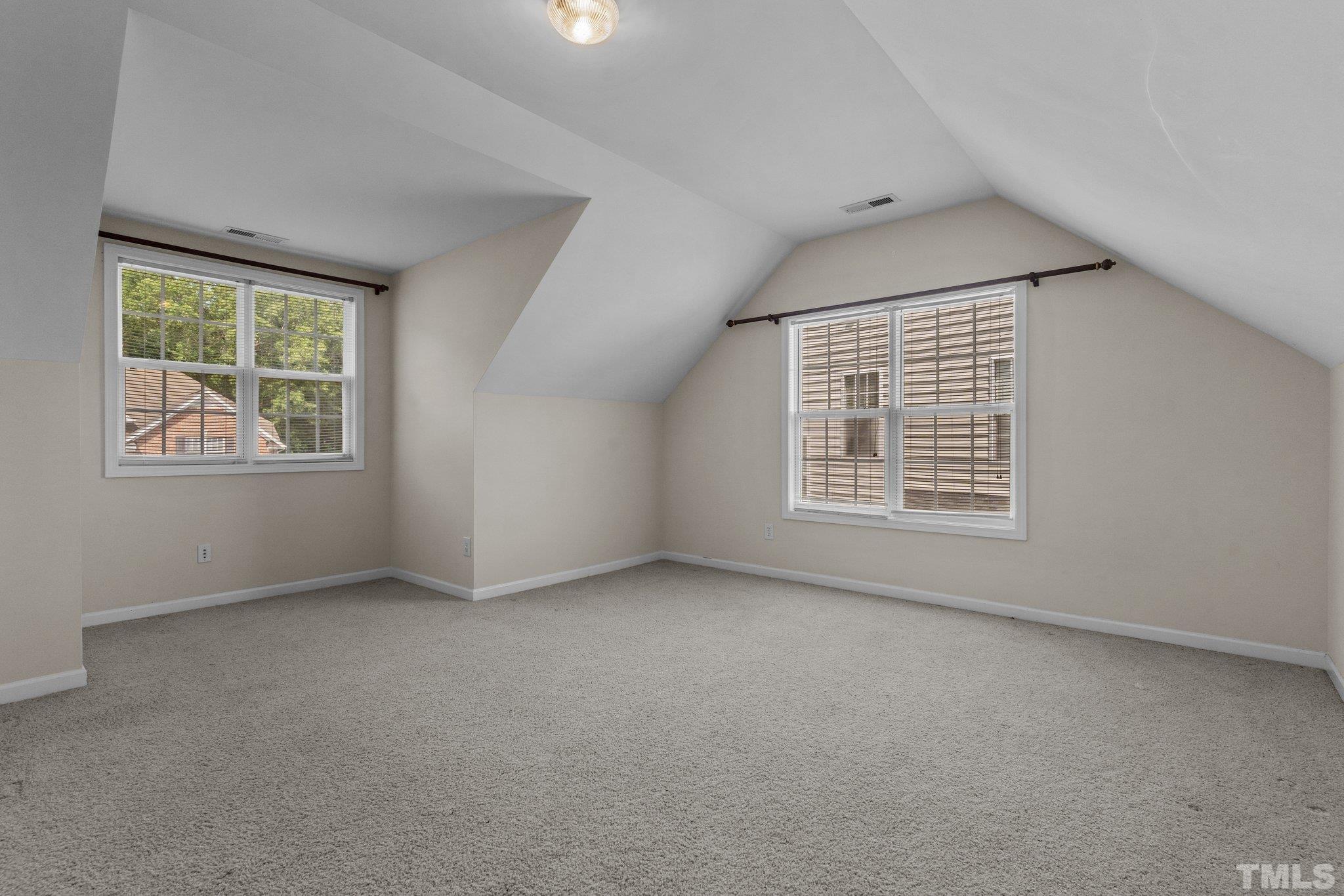 6010 Clarks Fork Drive Raleigh, NC 27616 - Photo 32 of 40 an empty room with windows