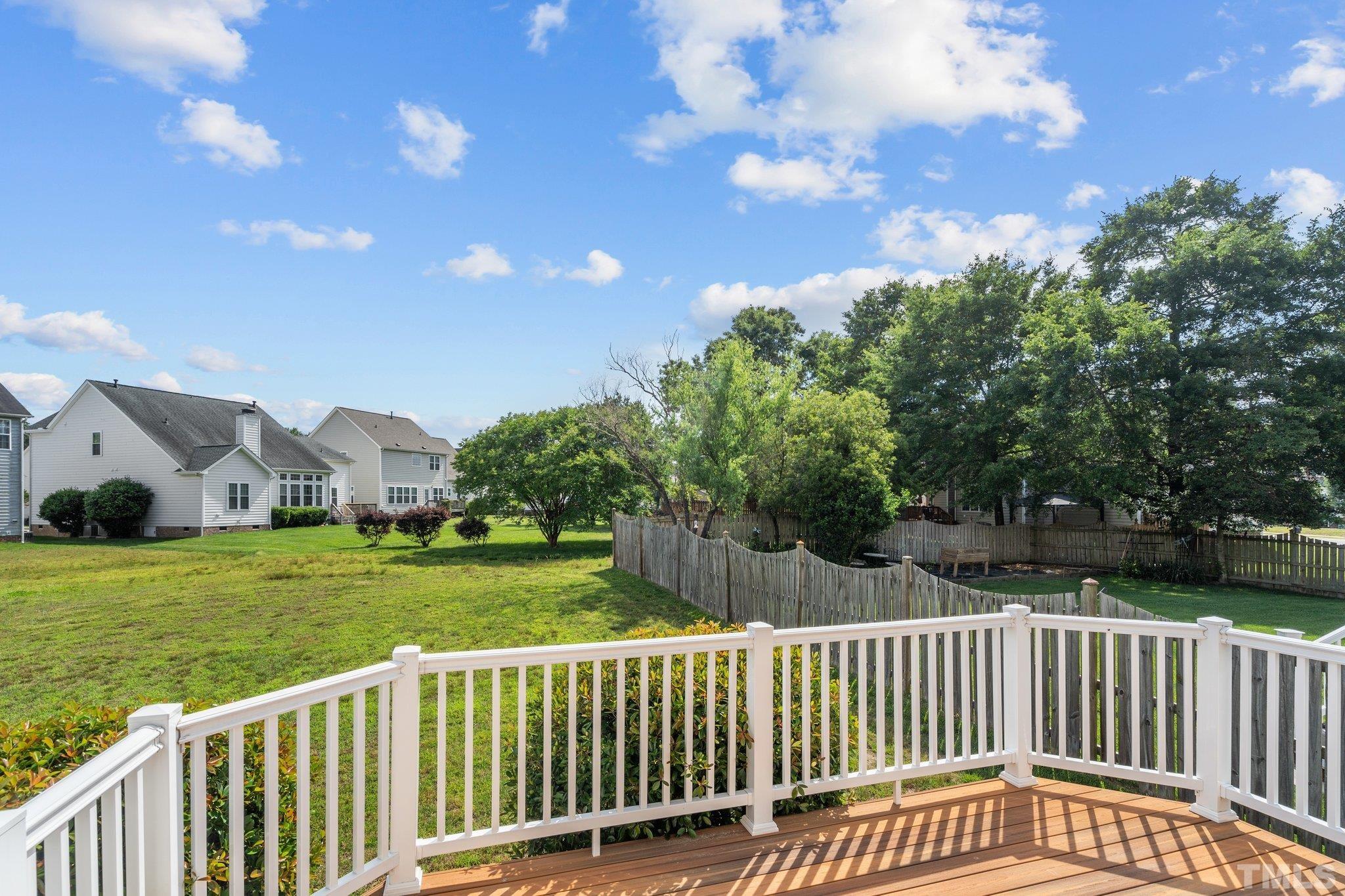 6010 Clarks Fork Drive Raleigh, NC 27616 - Photo 37 of 40 a view of a wooden deck and a yard
