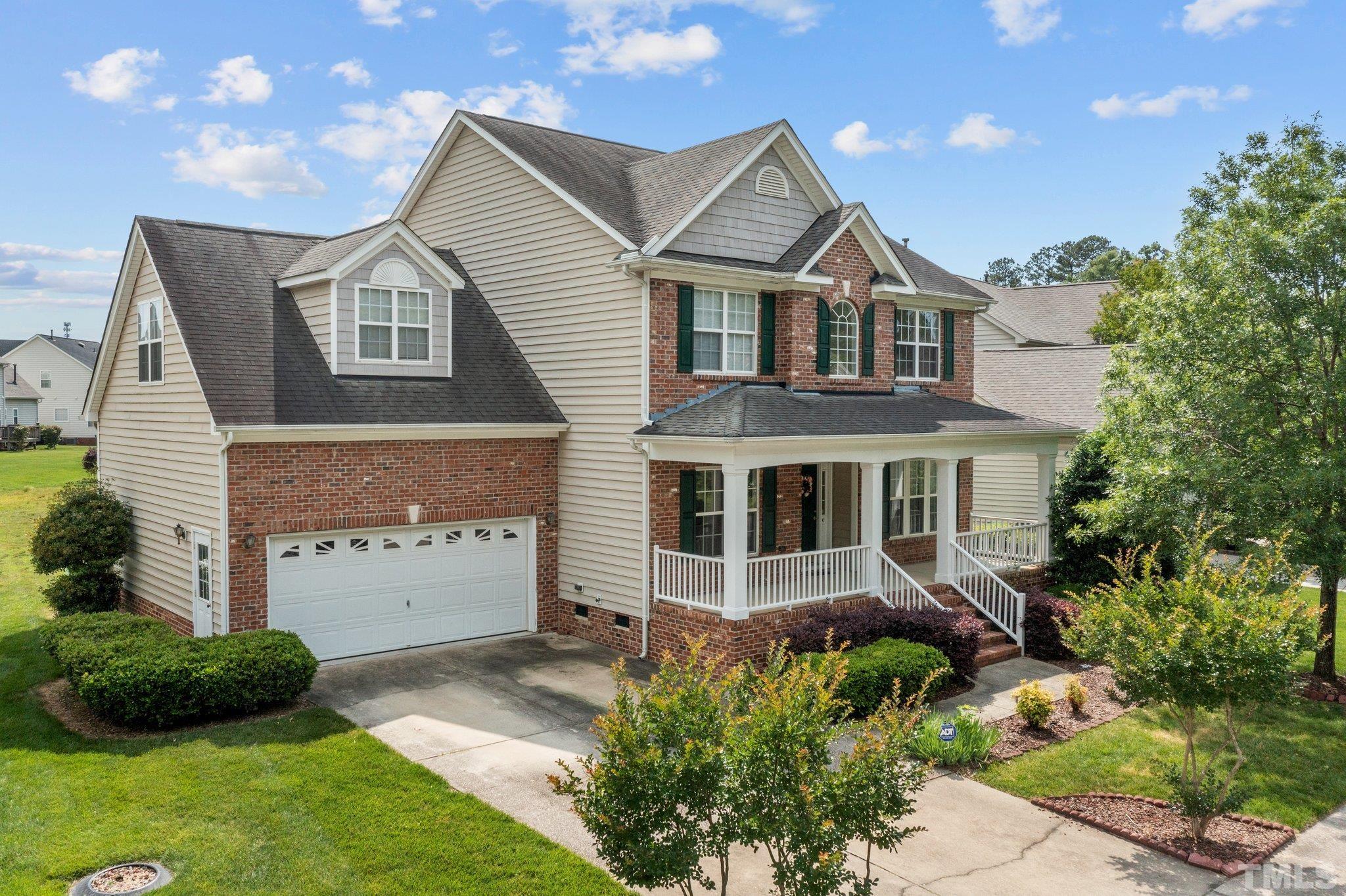 6010 Clarks Fork Drive Raleigh, NC 27616 - Photo 4 of 40 a front view of a house with a yard