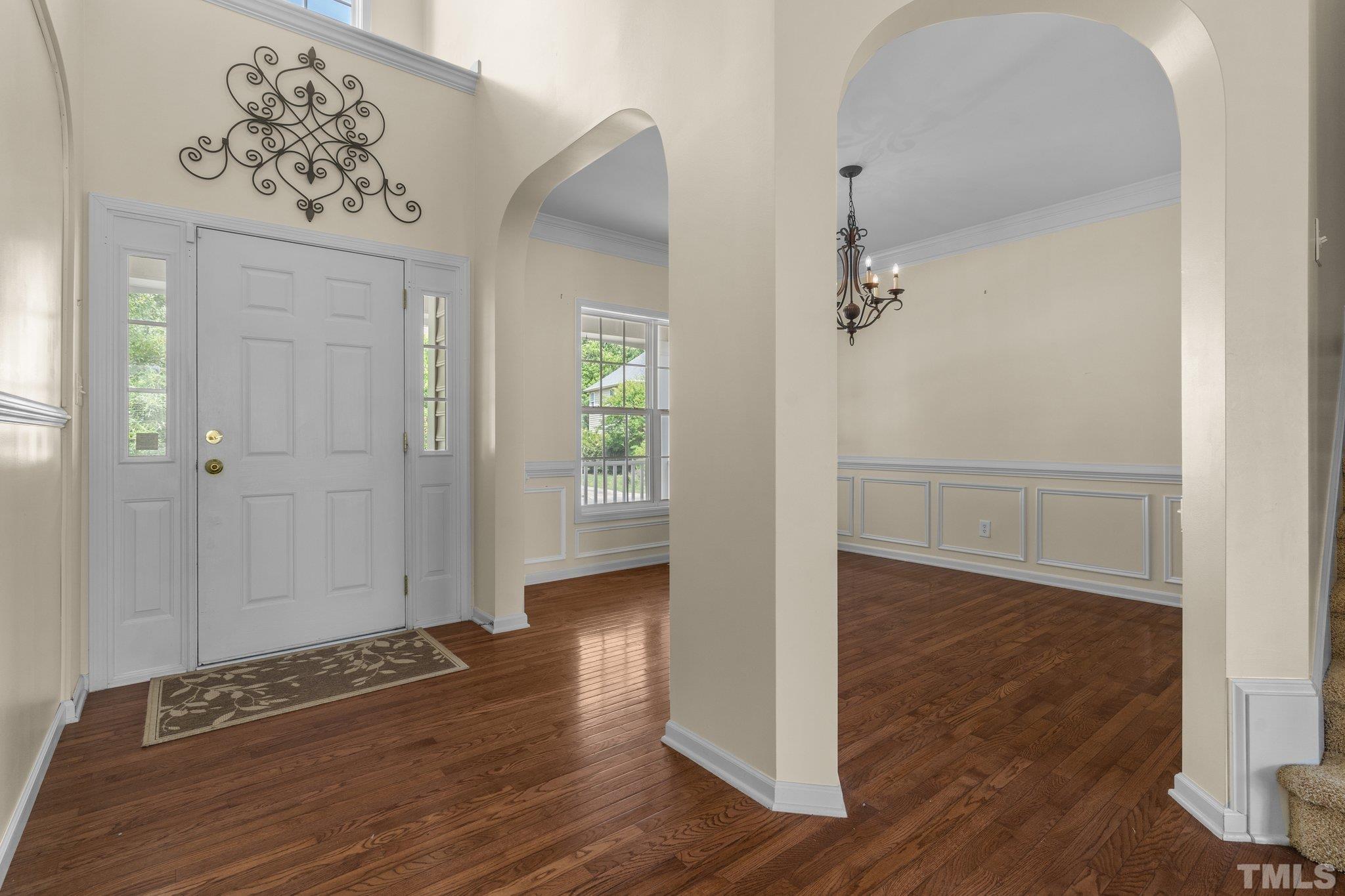 6010 Clarks Fork Drive Raleigh, NC 27616 - Photo 9 of 40 a view of a hallway with wooden floor