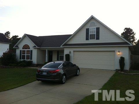 2008 Tingen Road Lillington, NC 27546 - Photo 1 of 25 a car parked in front of white house
