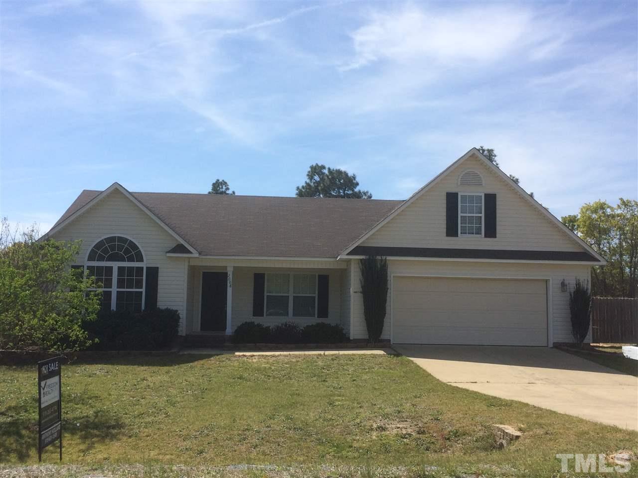 2008 Tingen Road Lillington, NC 27546 - Photo 2 of 25 front view of a house with a yard