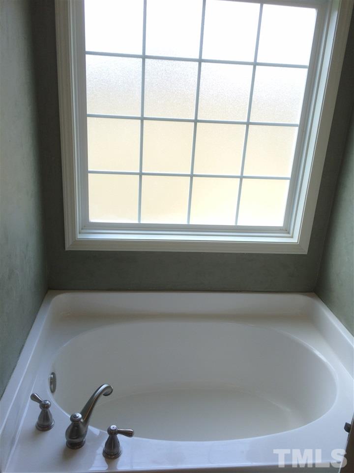 2008 Tingen Road Lillington, NC 27546 - Photo 11 of 25 a bathroom with a bathtub