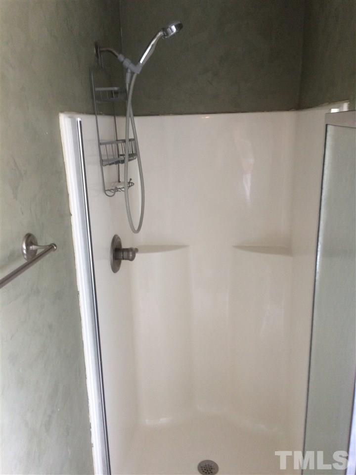 2008 Tingen Road Lillington, NC 27546 - Photo 12 of 25 a bathroom with a shower and a shower