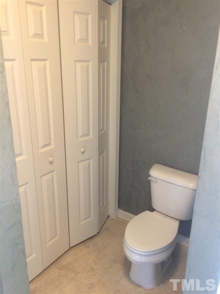2008 Tingen Road Lillington, NC 27546 - Photo 13 of 25 a white toilet sitting next to a shower