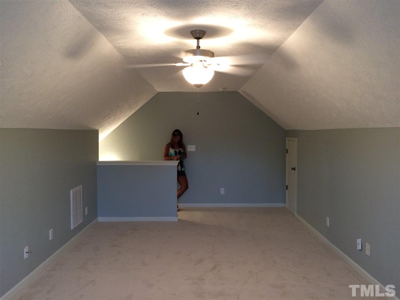 2008 Tingen Road Lillington, NC 27546 - Photo 17 of 25 en empty room with windows and ceiling fan