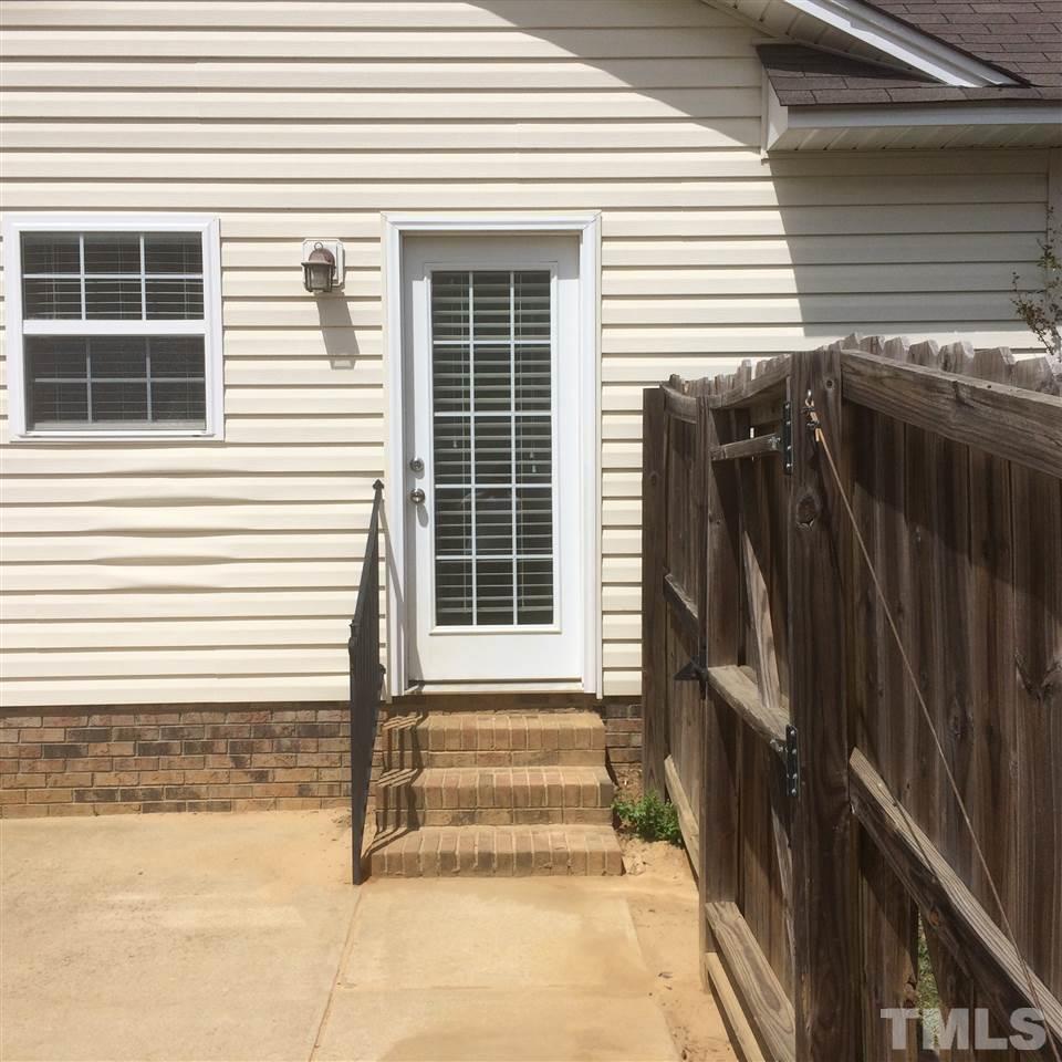 2008 Tingen Road Lillington, NC 27546 - Photo 20 of 25 a front view of a house with a window