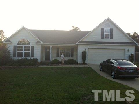 2008 Tingen Road Lillington, NC 27546 - Photo 25 of 25 a front view of a house with a garden