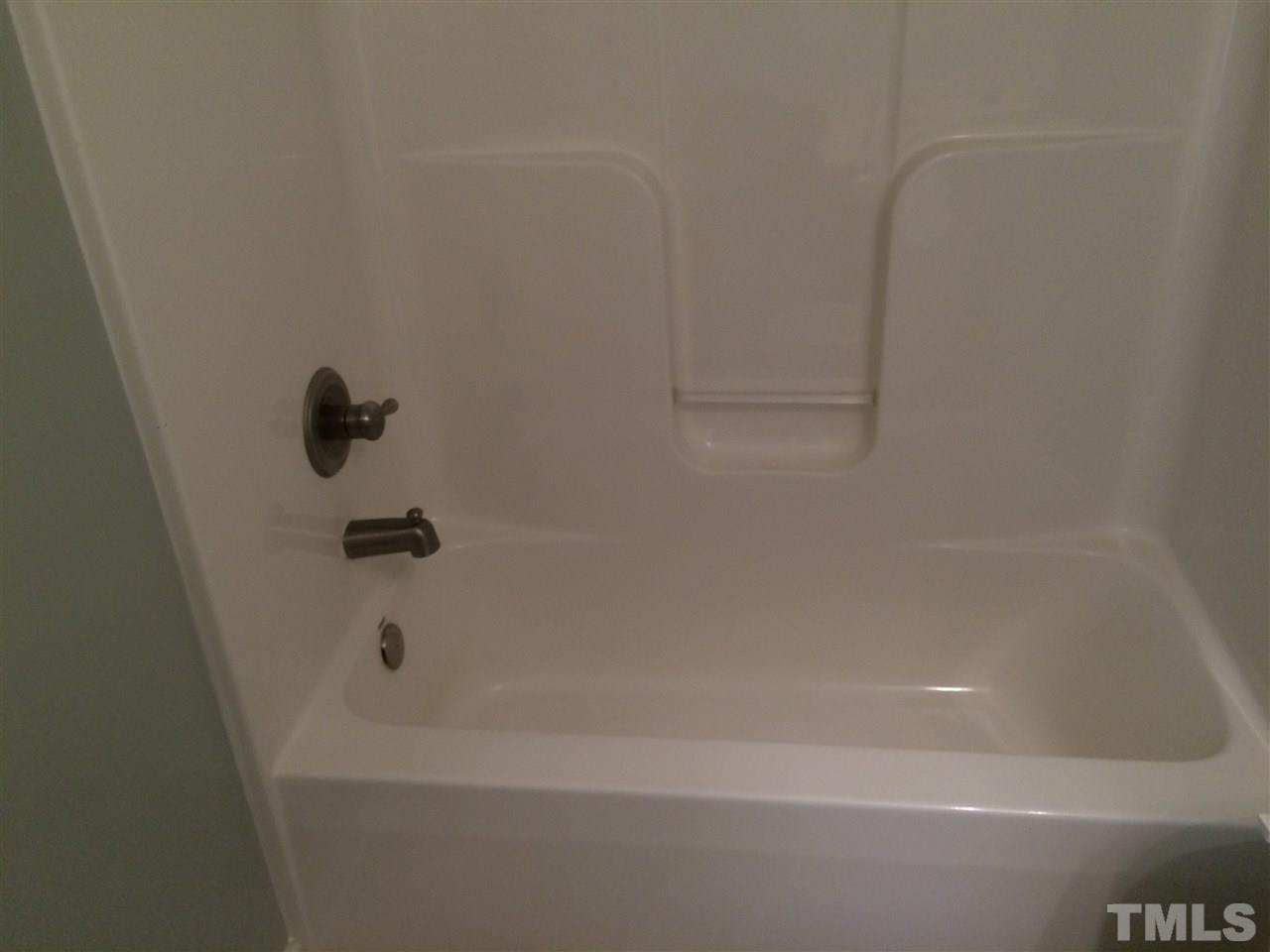 2008 Tingen Road Lillington, NC 27546 - Photo 9 of 25 a bathroom with a bathtub
