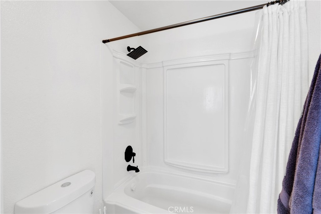 14769 Nanticoke Road Apple Valley, CA 92307 - Photo 17 of 30 a bathroom with a shower and a bath tub