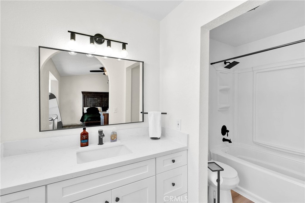 14769 Nanticoke Road Apple Valley, CA 92307 - Photo 18 of 30 a bathroom with a bathtub and a sink