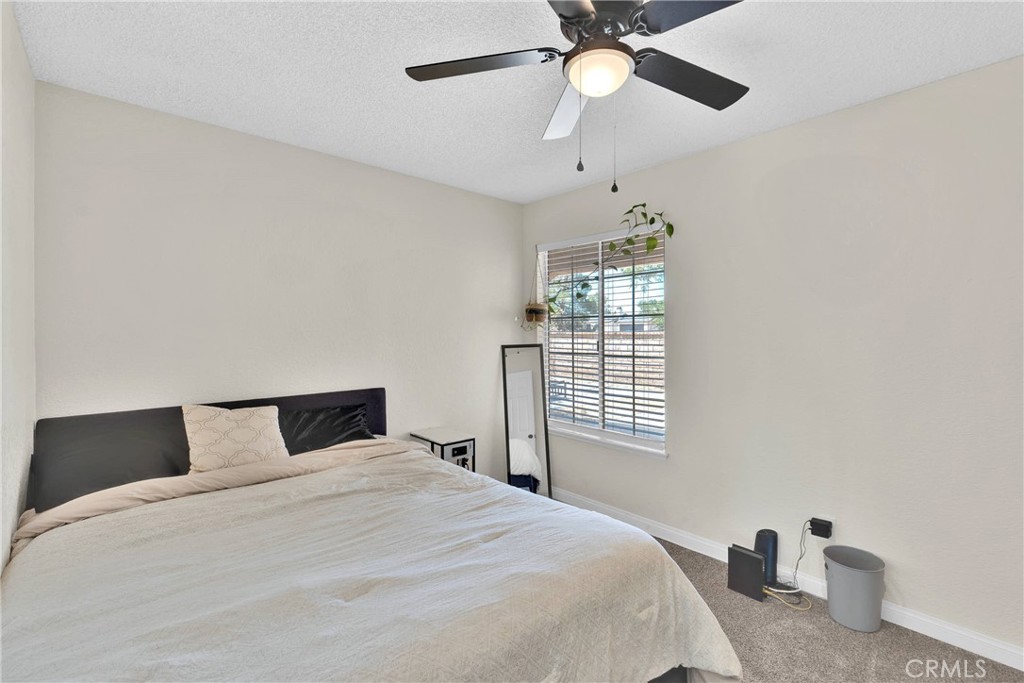 14769 Nanticoke Road Apple Valley, CA 92307 - Photo 23 of 30 a bedroom with a bed and window