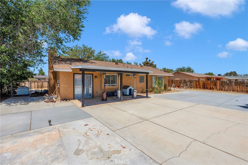 14769 Nanticoke Road Apple Valley, CA 92307 - Photo 28 of 30 a view of house with outdoor space and sitting area