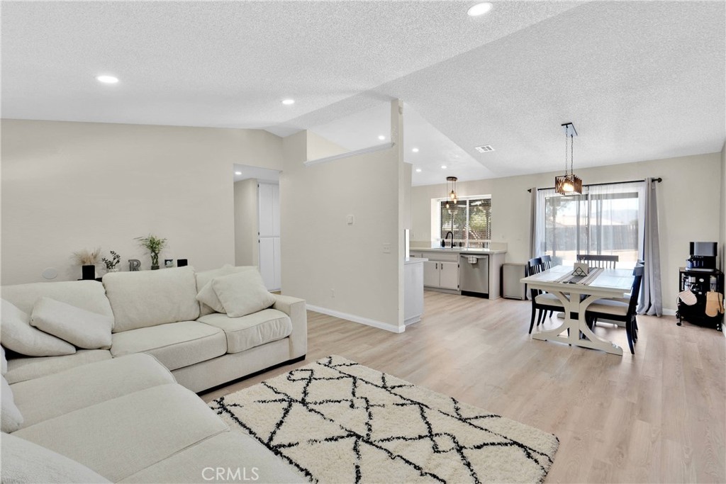 14769 Nanticoke Road Apple Valley, CA 92307 - Photo 5 of 30 a living room with furniture and wooden floor