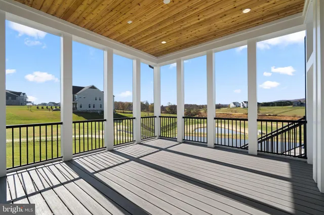 a view of balcony with wooden floor