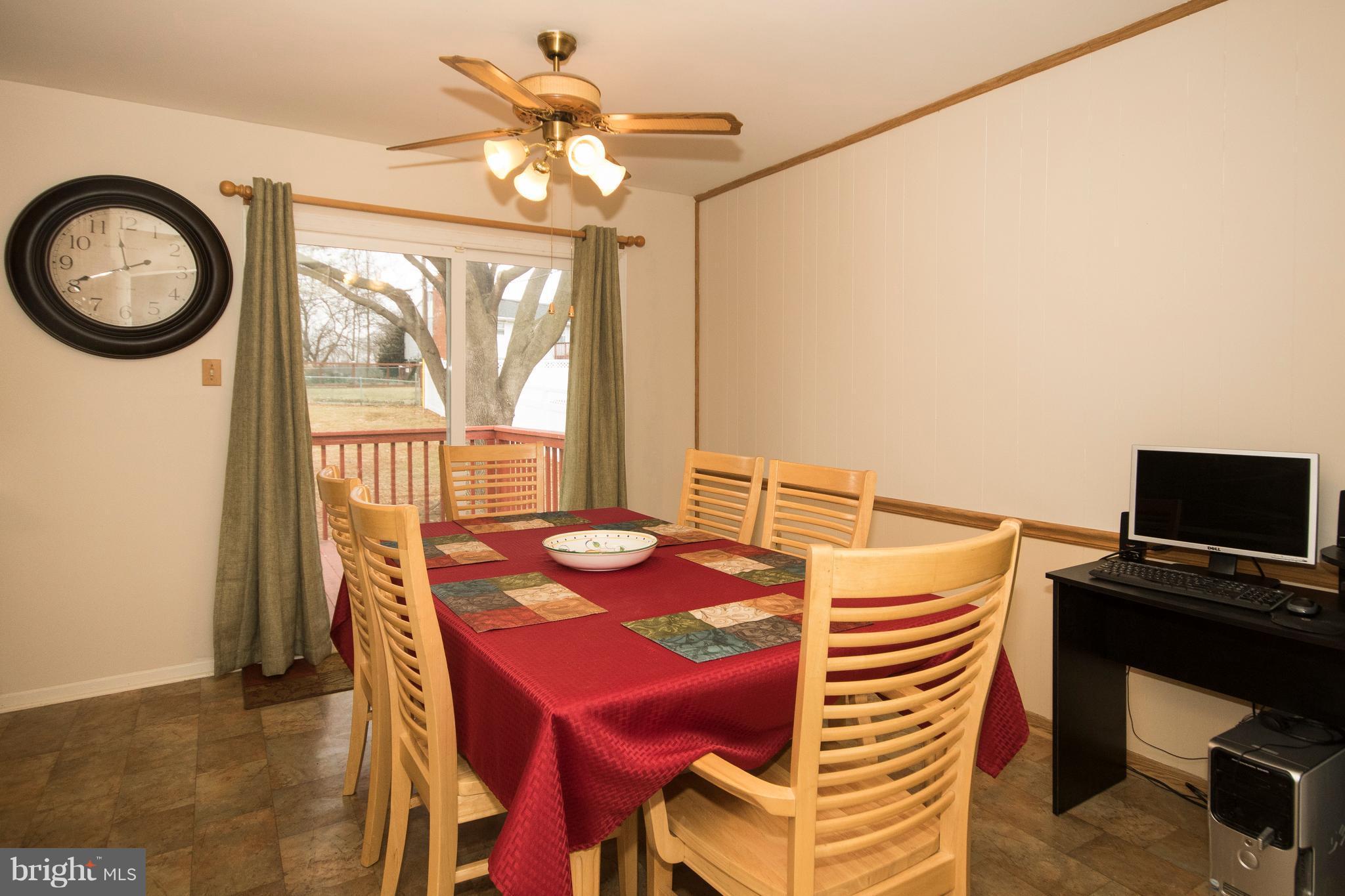 228 Embleton Road Owings Mills, MD 21117 - Photo 6 of 24 a view of a dining room with furniture and a chandelier