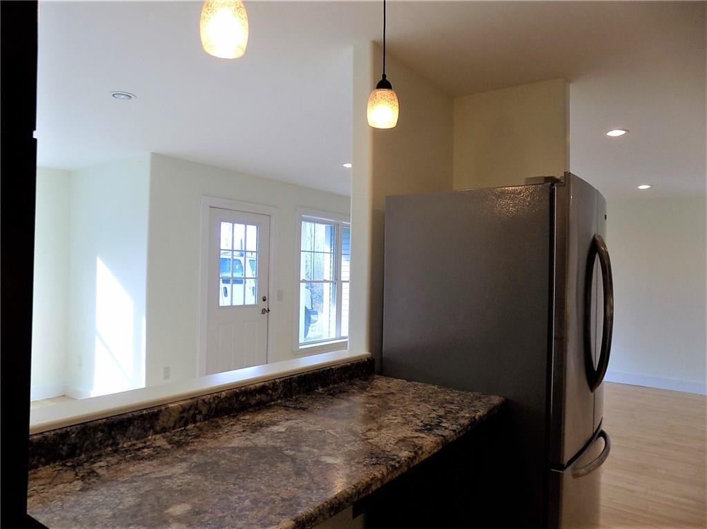 29 Apple Tree Way Ellsworth, ME 04605 - Photo 8 of 35 There's a pass thru to the dining...