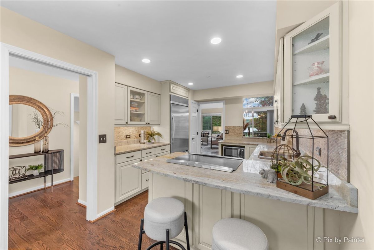 831 Shoreline Road Lake Barrington, IL 60010 - Photo 11 of 47 a kitchen with sink stove and chairs