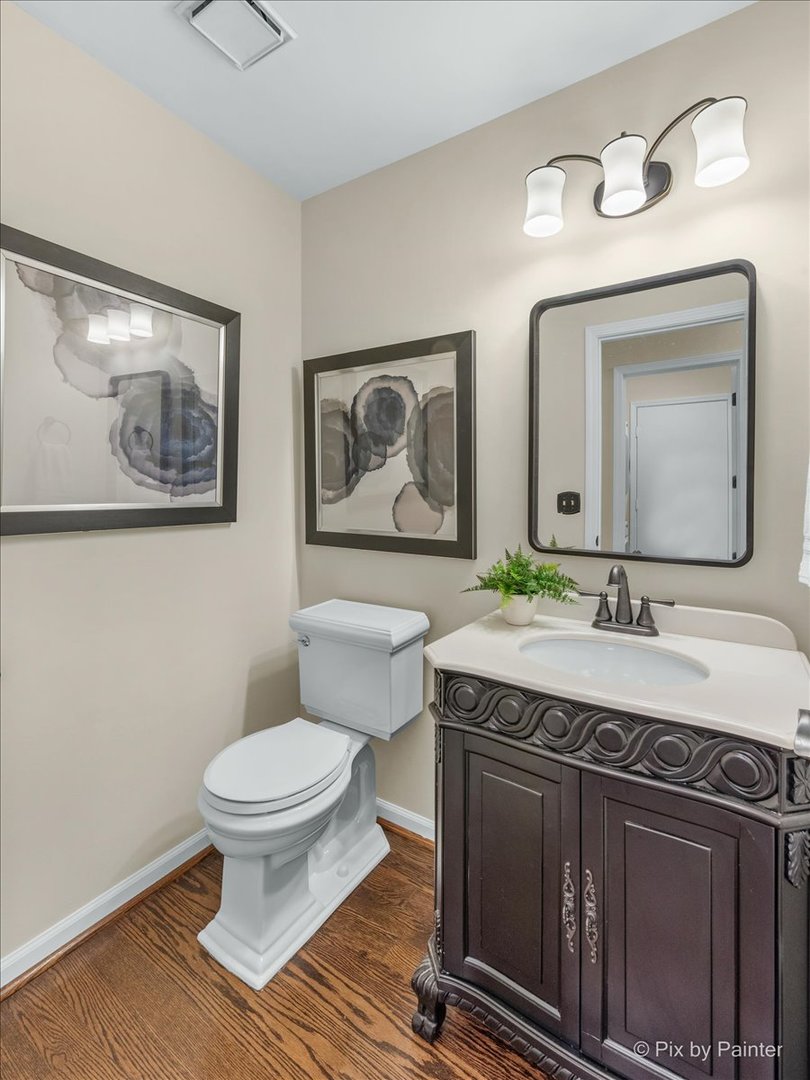 831 Shoreline Road Lake Barrington, IL 60010 - Photo 15 of 47 a bathroom with a toilet a sink and mirror