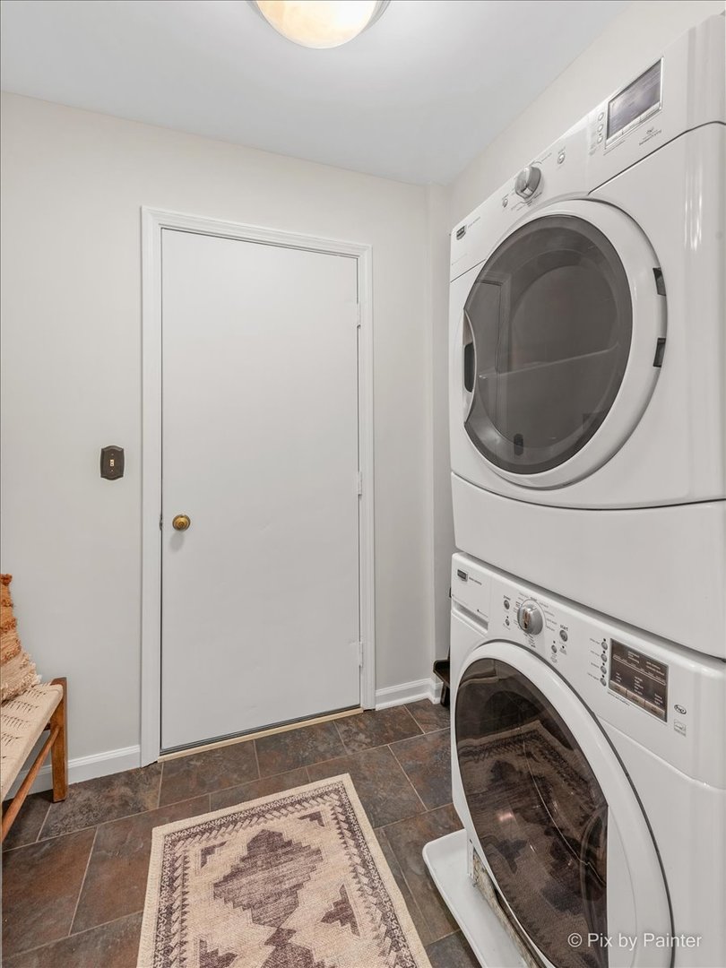 831 Shoreline Road Lake Barrington, IL 60010 - Photo 16 of 47 a view of a hallway with washer and dryer