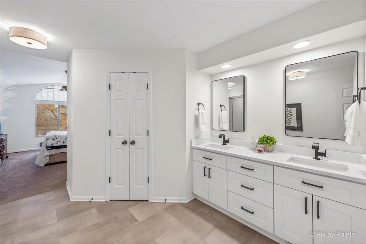 831 Shoreline Road Lake Barrington, IL 60010 - Photo 19 of 47 a bathroom with a double vanity sink and mirror