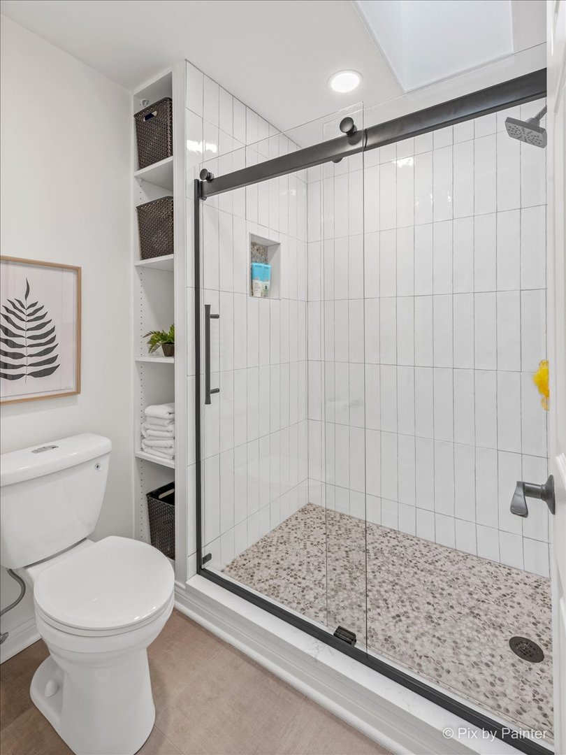 831 Shoreline Road Lake Barrington, IL 60010 - Photo 21 of 47 a bathroom with a shower and a toilet