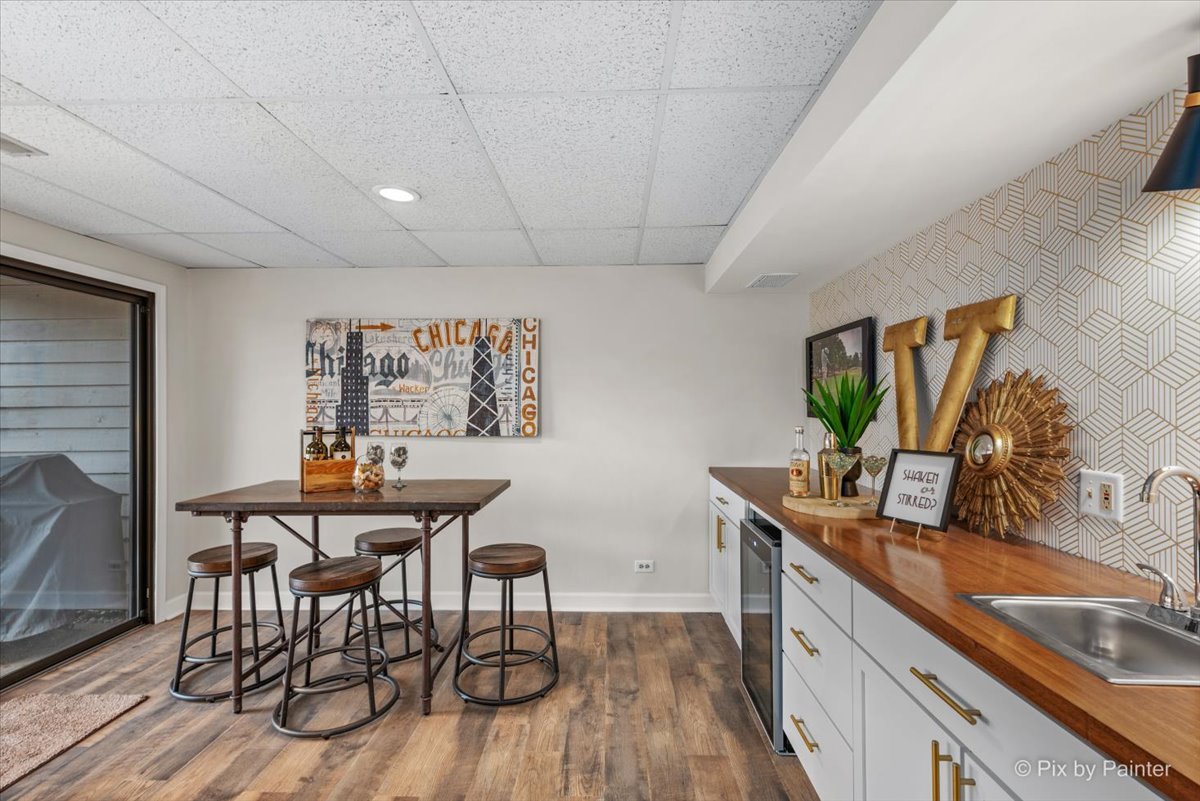 831 Shoreline Road Lake Barrington, IL 60010 - Photo 28 of 47 a view of a kitchen area with furniture and wooden floor