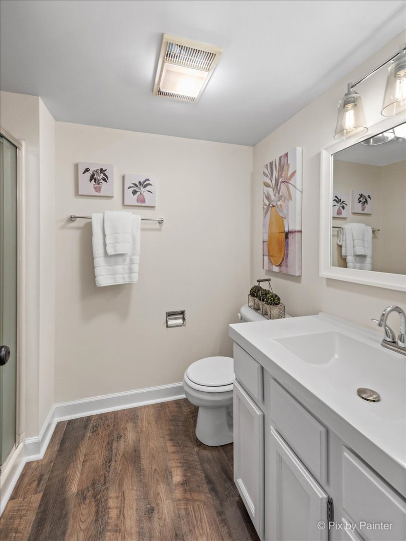 831 Shoreline Road Lake Barrington, IL 60010 - Photo 32 of 47 a bathroom with a sink toilet and mirror